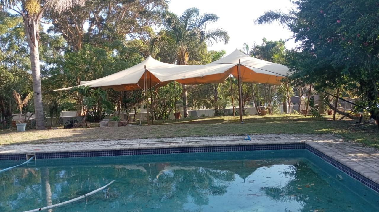 Stretch tent over poolside